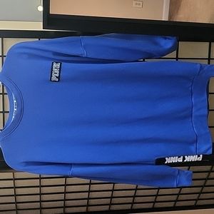 Pink.. blue sweatshirt zippers on each side of the bottom. XS loose fit.